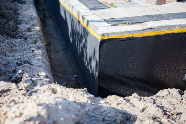 Professional Waterproofing technician working in Kipton, OH